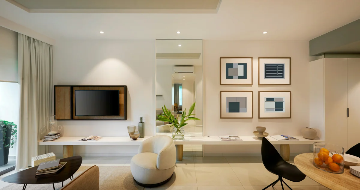 Serviced apartment living room with modern art, full-length mirror, and designer furniture